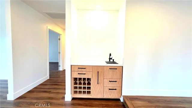 a view of bedroom with wooden floor