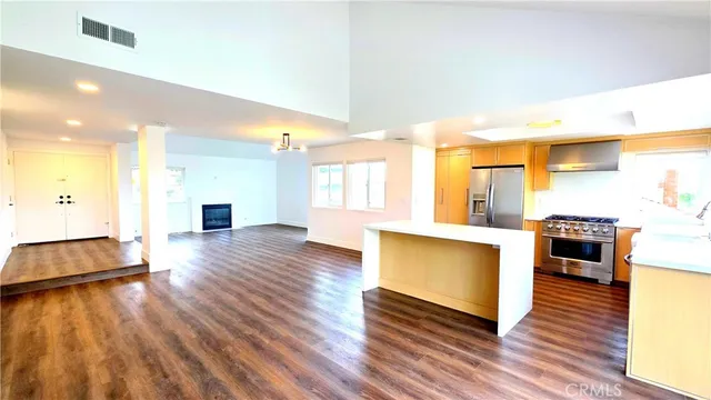 a view of kitchen with cabinets and wooden floor