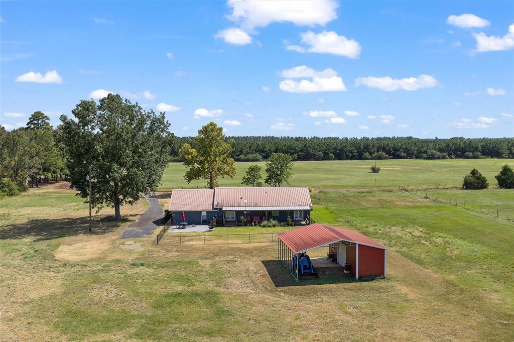 1131 Speights Road Keatchie, LA 71046 - Photo 10 of 33 Single-story residence with a metal roof and an attached patio