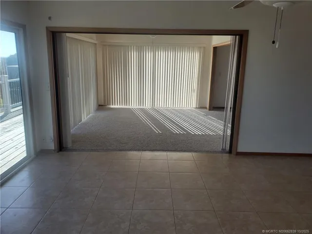 a view of an empty room and window