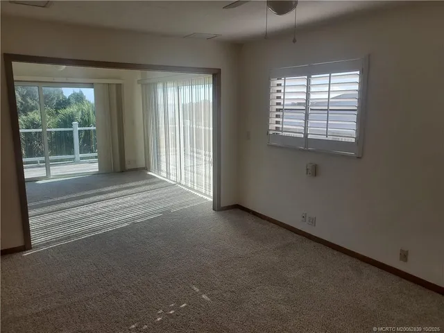 a view of a room with a large window