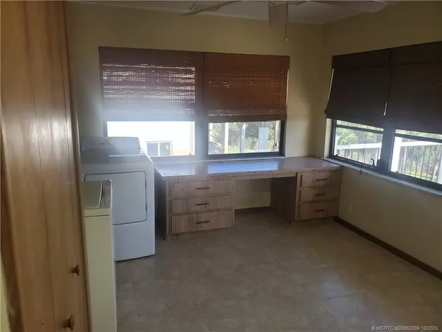 a view of balcony with wooden floor and fence