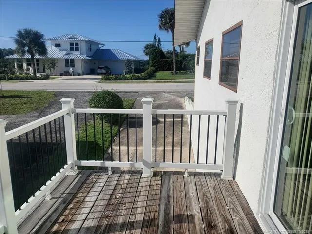 a view of balcony with furniture