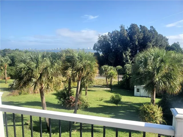 a view of balcony with wooden floor