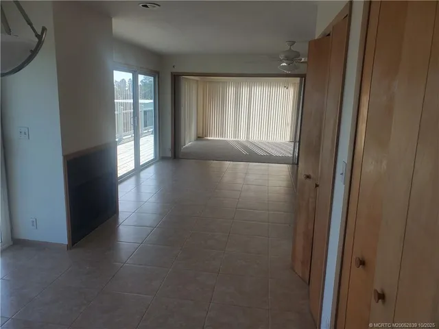 a view of an empty room and window