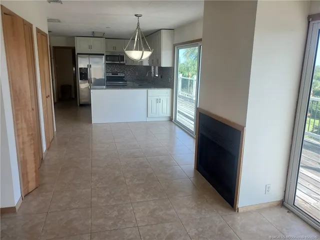 a kitchen with stainless steel appliances a refrigerator and a sink