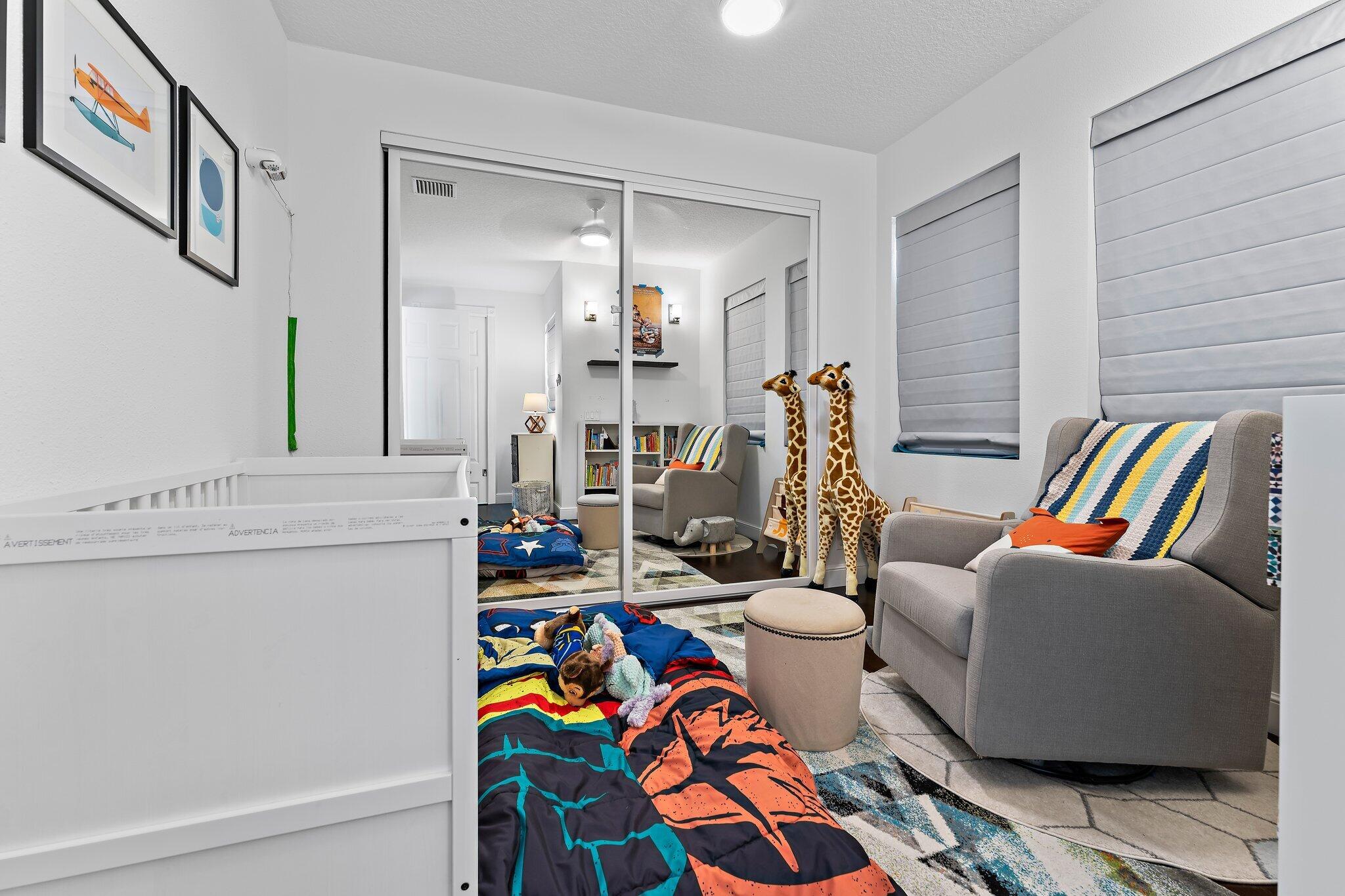 807 Xanadu Place Jupiter, FL 33477 - Photo 24 of 36 a living room with furniture and a table
