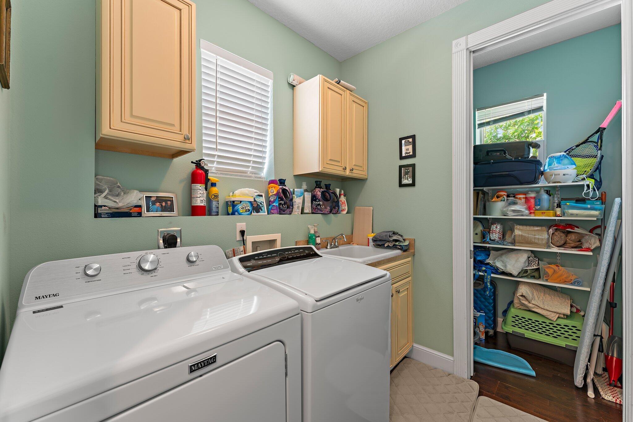 807 Xanadu Place Jupiter, FL 33477 - Photo 27 of 36 a utility room with dryer washer and a window