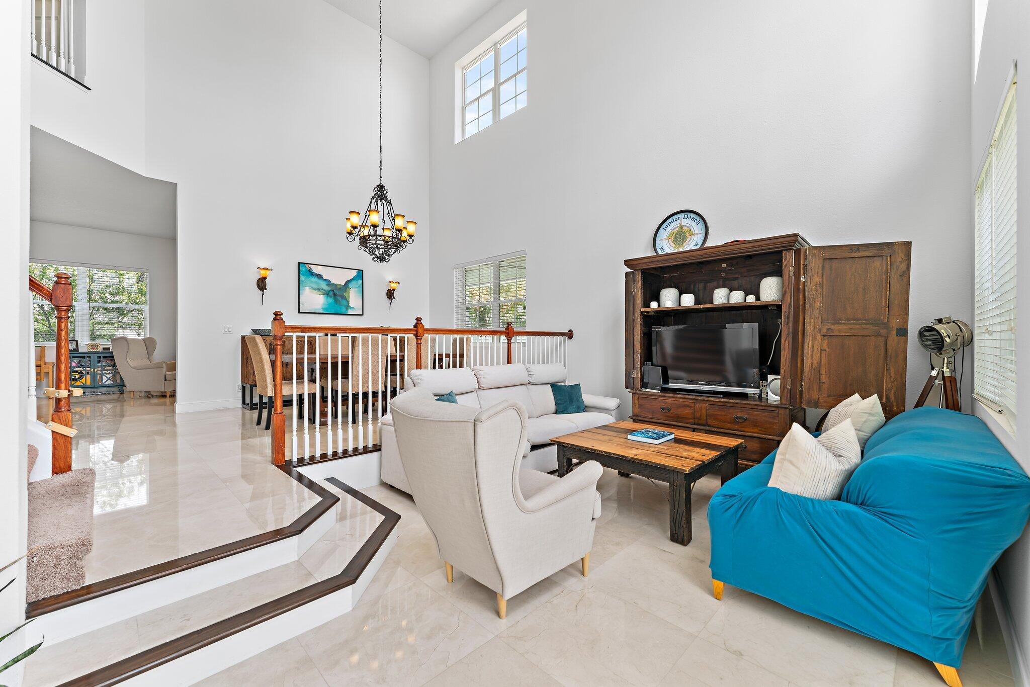 807 Xanadu Place Jupiter, FL 33477 - Photo 5 of 36 a bedroom with furniture and a window