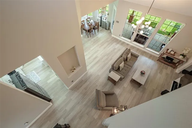 a view of living room with furniture and a fireplace