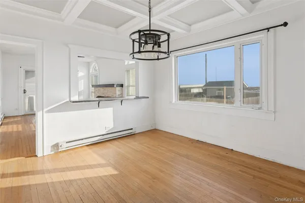 a view of a kitchen with a dishwasher cabinets and a wooden floor