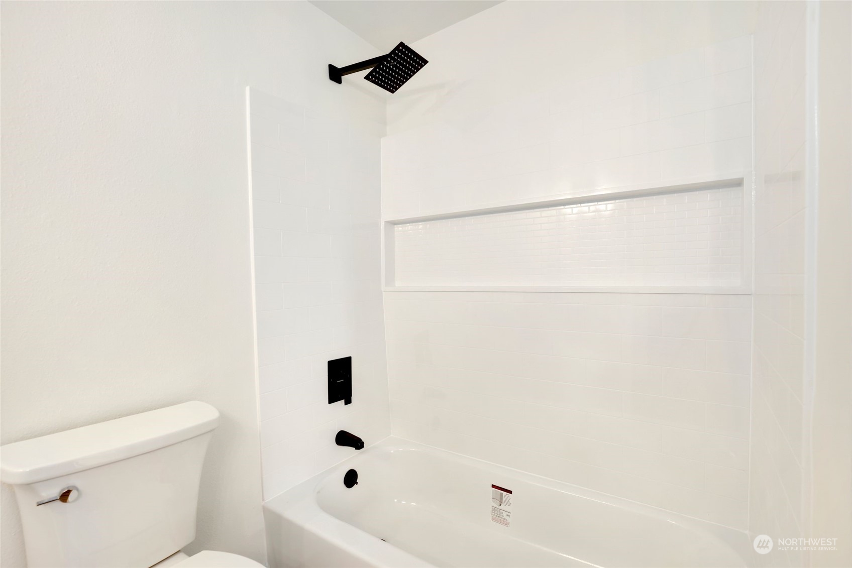 3672 Southwest 318th Street Federal Way, WA 98023 - Photo 21 of 40 a bathroom with a bathtub and a toilet