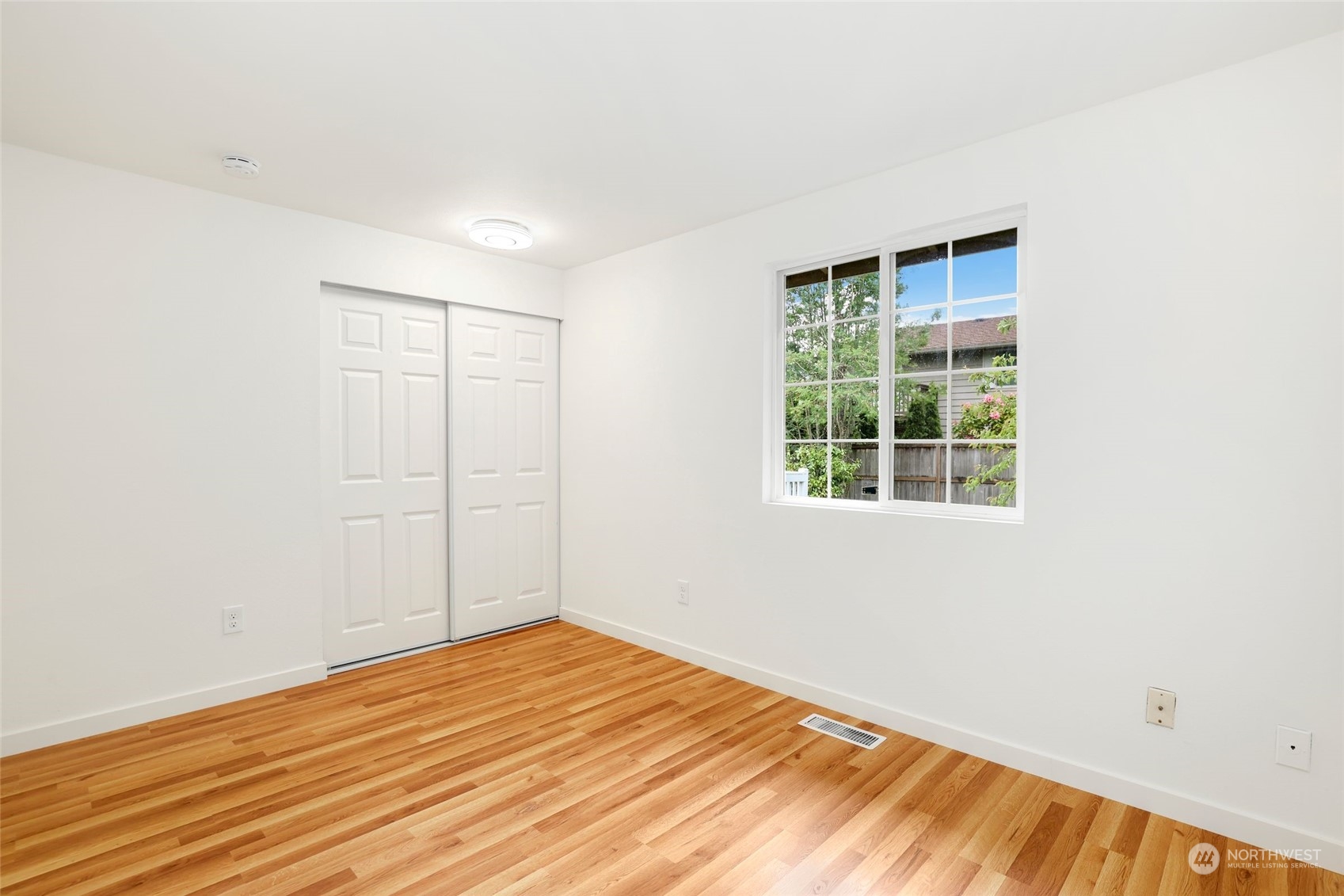 3672 Southwest 318th Street Federal Way, WA 98023 - Photo 23 of 40 an empty room with wooden floor and windows