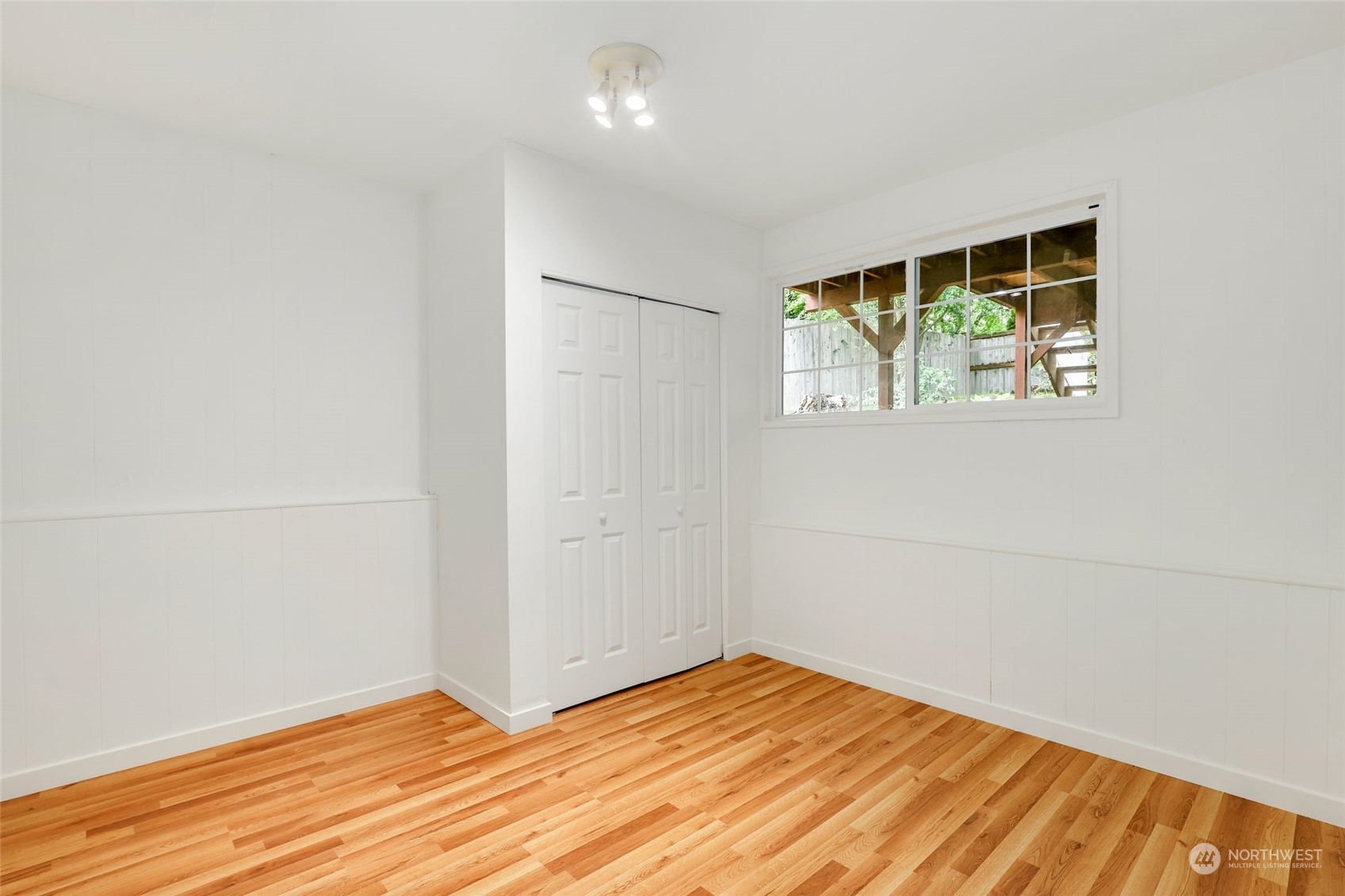 3672 Southwest 318th Street Federal Way, WA 98023 - Photo 27 of 40 an empty room with wooden floor and windows