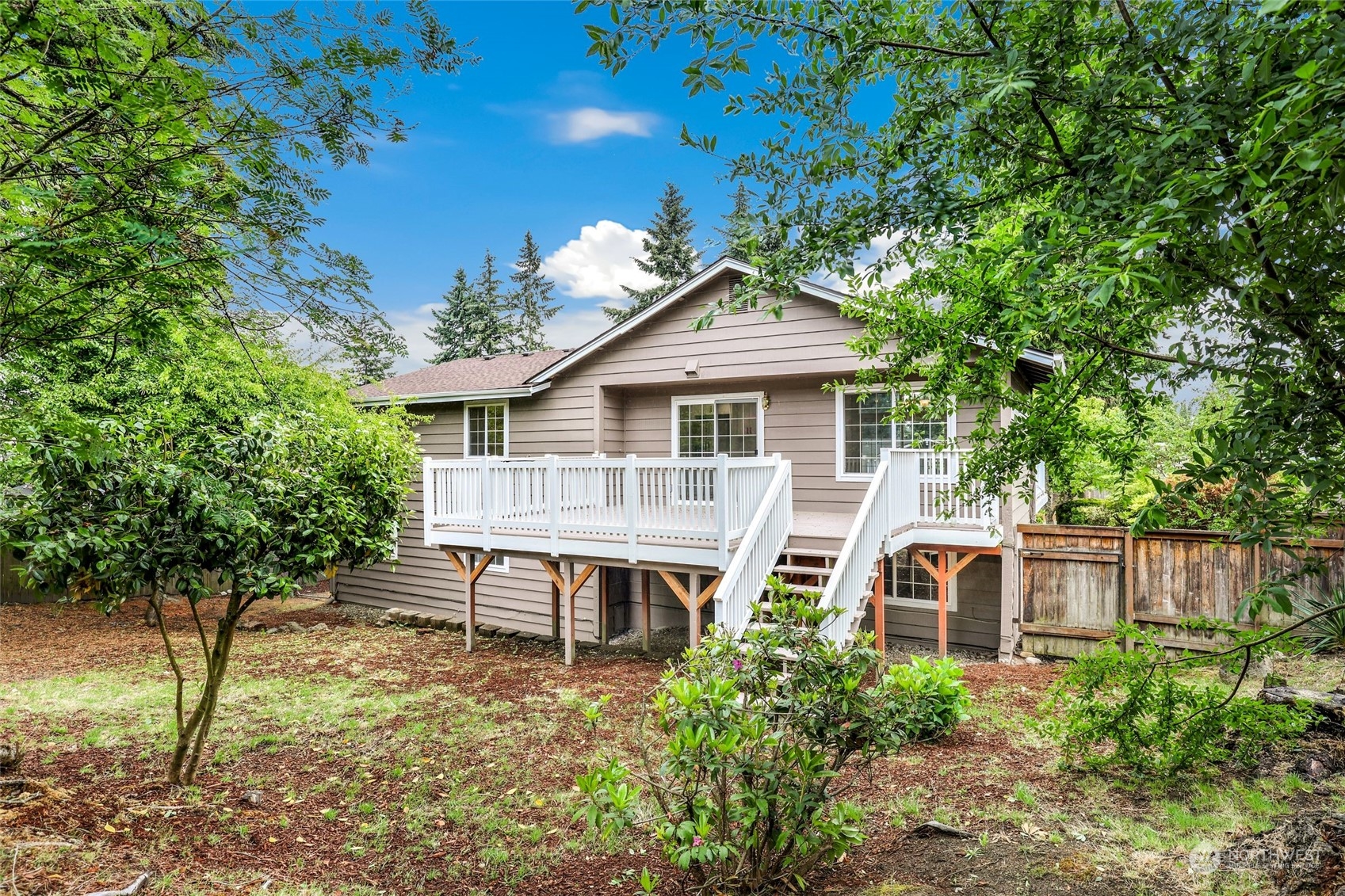 3672 Southwest 318th Street Federal Way, WA 98023 - Photo 32 of 40 a backyard of a house with table and chairs