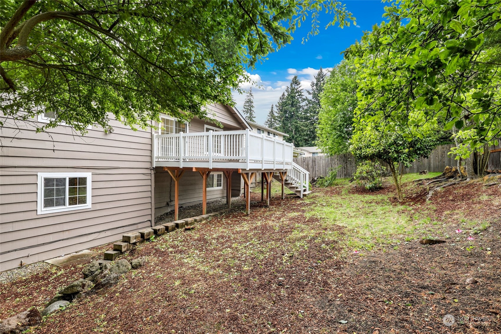 3672 Southwest 318th Street Federal Way, WA 98023 - Photo 33 of 40 a house with trees in the background