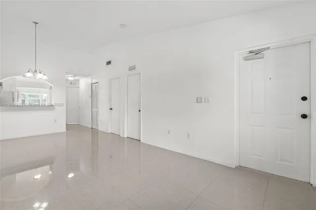 a view of a kitchen with a sink and a window
