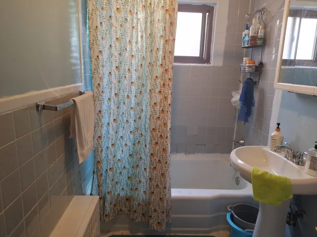 a bathroom with a sink and bathtub