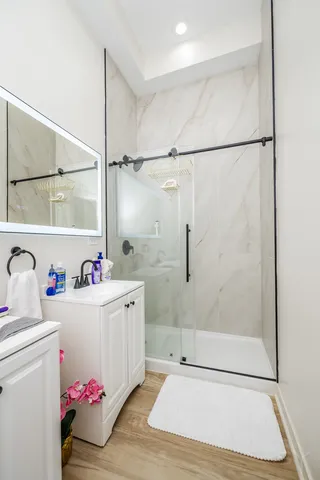 a kitchen with stainless steel appliances a refrigerator sink and cabinets