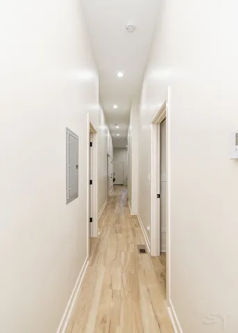 a large kitchen with stainless steel appliances granite countertop a stove a sink and a refrigerator