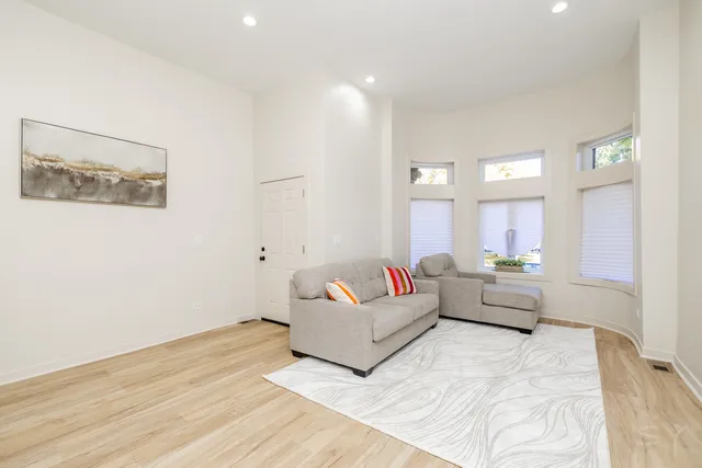 a kitchen with stainless steel appliances a refrigerator sink and microwave