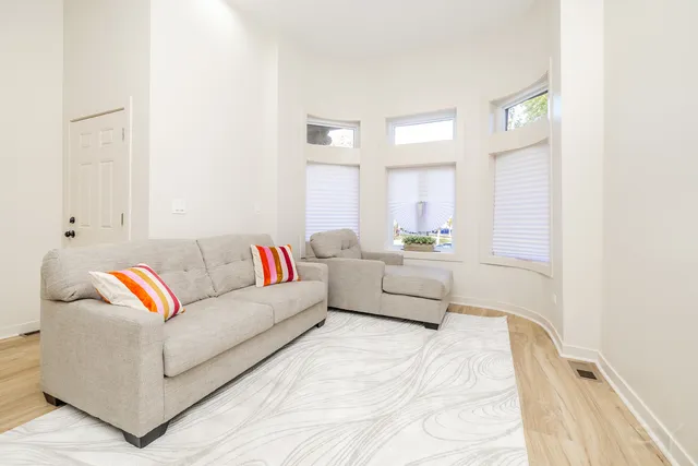 a kitchen with stainless steel appliances a refrigerator sink and microwave