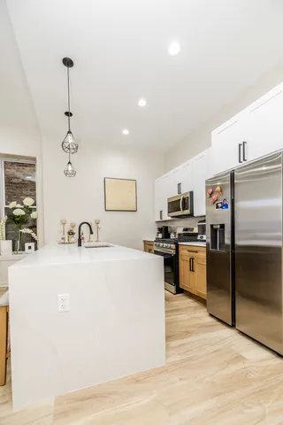 a bedroom with a bed and a cabinets