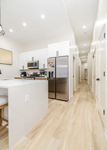 a bedroom with a bed and a tv