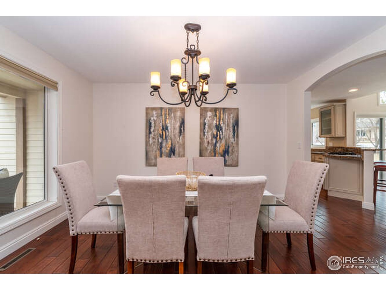 7177 Four Rivers Road Boulder, CO 80301 - Photo 13 of 32 a view of a dining room with furniture a chandelier and wooden floor