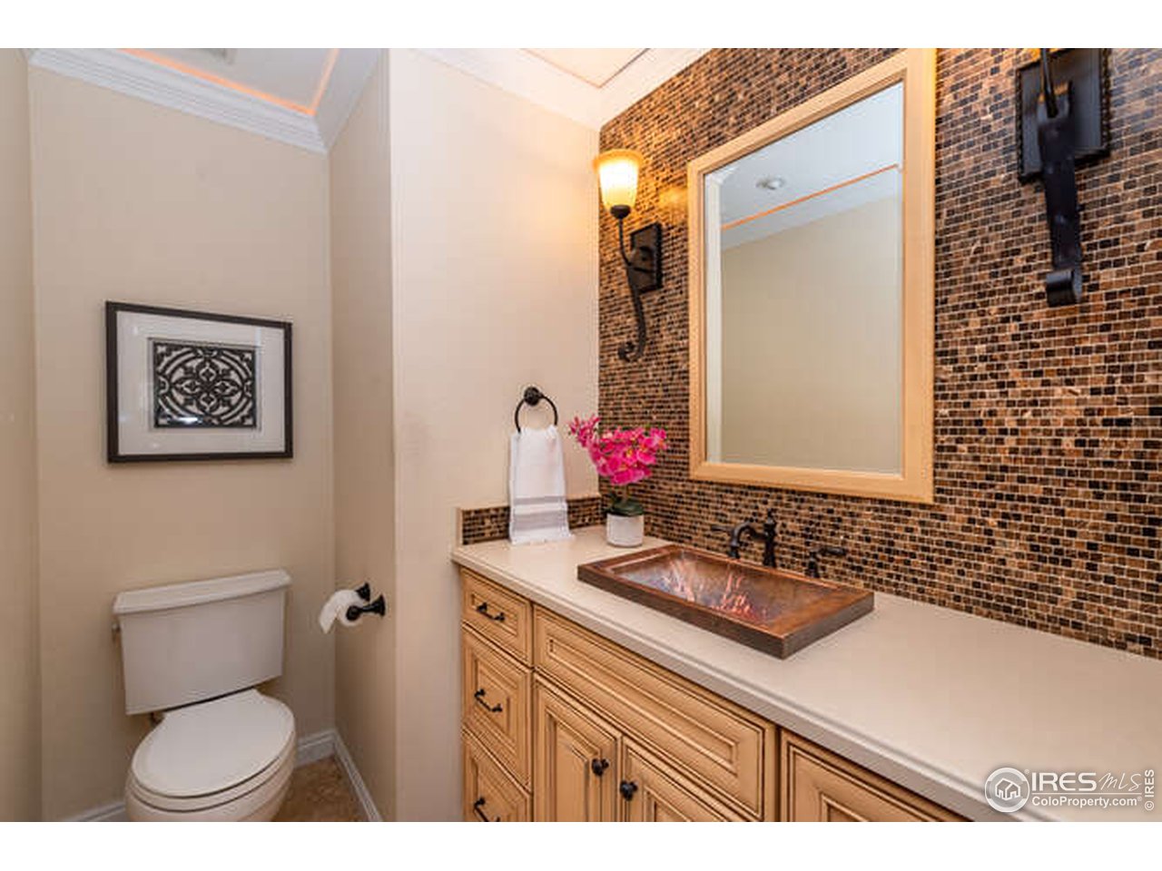 7177 Four Rivers Road Boulder, CO 80301 - Photo 25 of 32 a bathroom with a sink a toilet and mirror