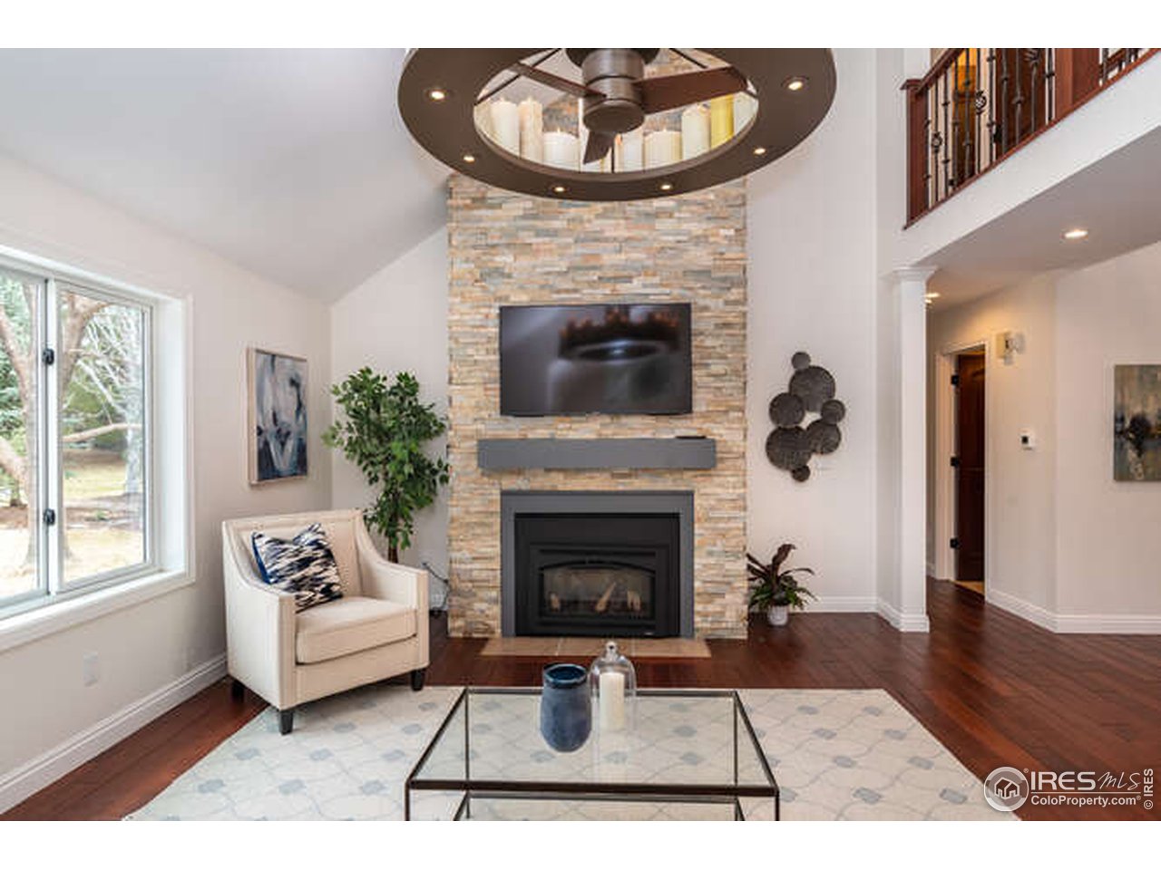 7177 Four Rivers Road Boulder, CO 80301 - Photo 3 of 32 a living room with furniture and a fireplace