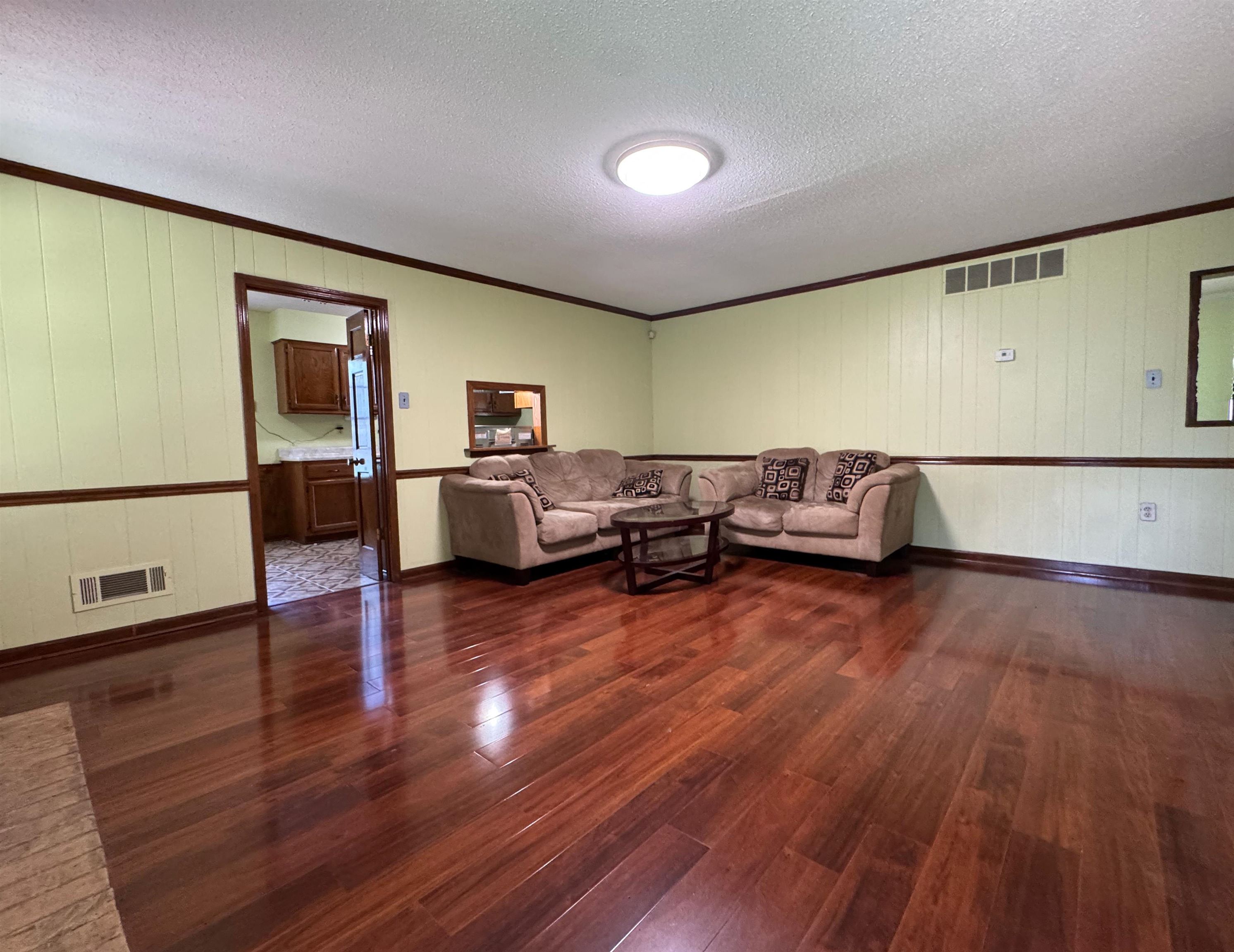 3213 Covington Pike Memphis, TN 38128 - Photo 3 of 17 a living room with furniture and wooden floor
