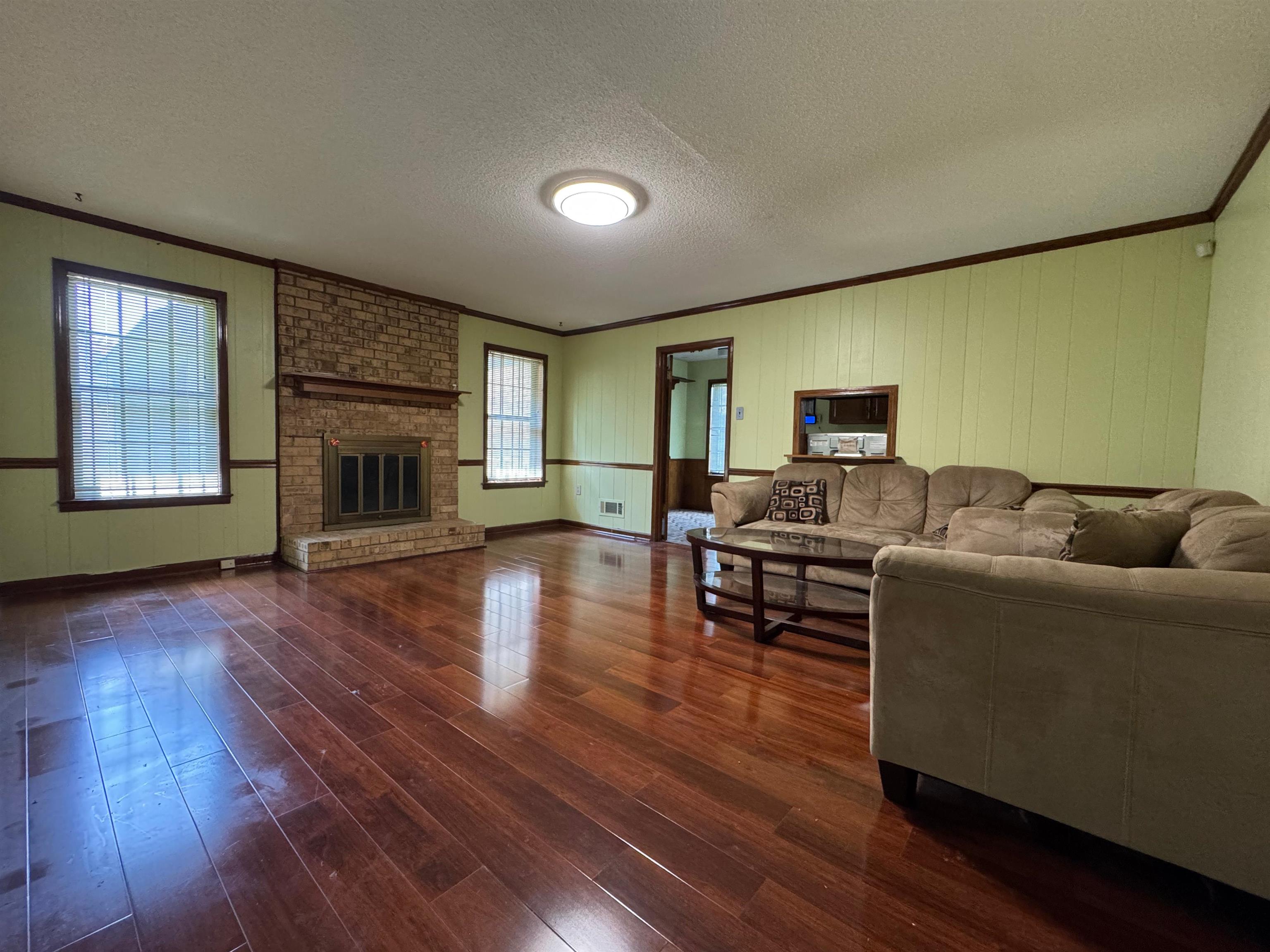 3213 Covington Pike Memphis, TN 38128 - Photo 5 of 17 a living room with furniture and a fireplace