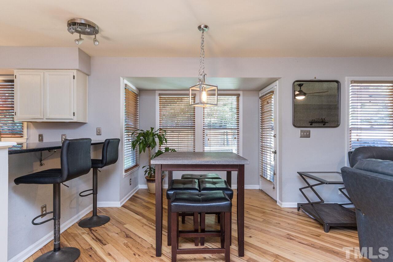 2400 Long And Winding Road Raleigh, NC 27603 - Photo 12 of 29 a living room with furniture a flat screen tv and a window