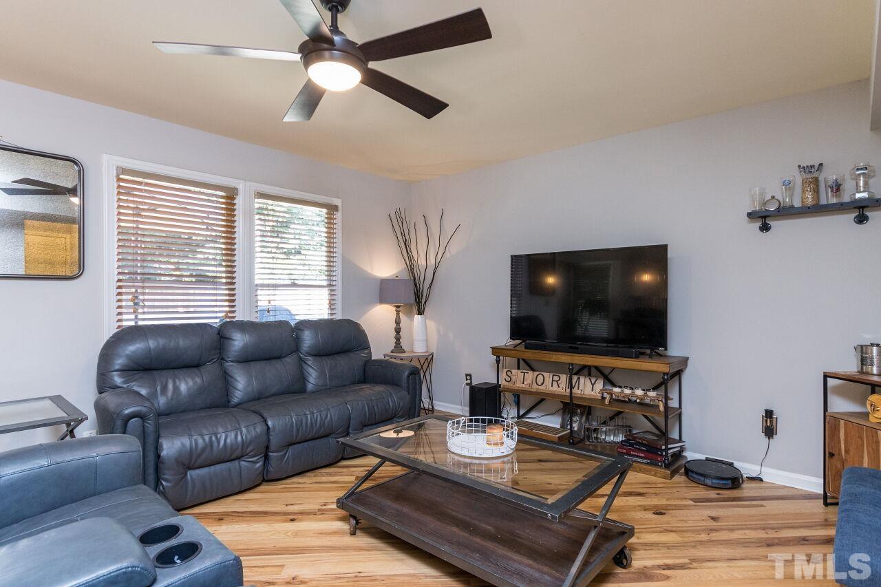 2400 Long And Winding Road Raleigh, NC 27603 - Photo 14 of 29 a living room with furniture and a flat screen tv