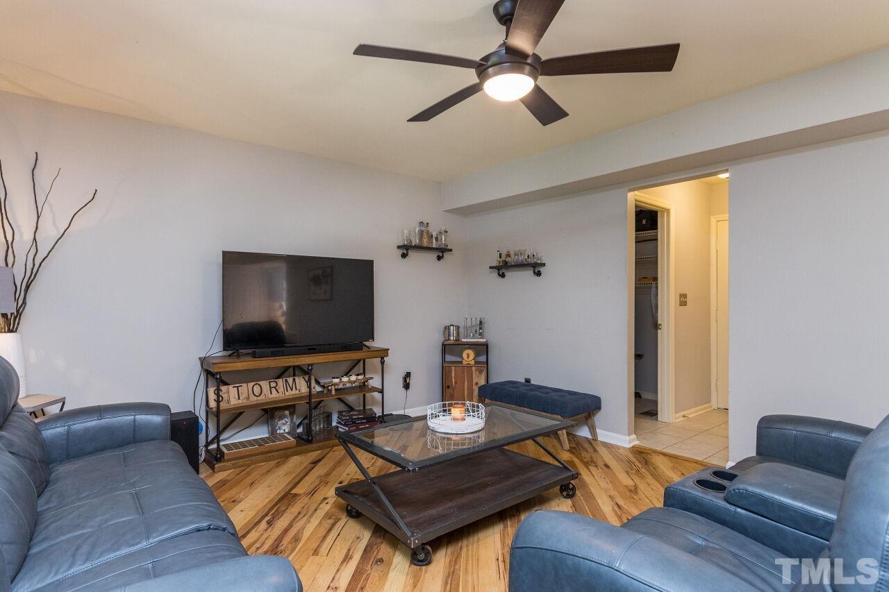 2400 Long And Winding Road Raleigh, NC 27603 - Photo 15 of 29 a living room with furniture and a flat screen tv