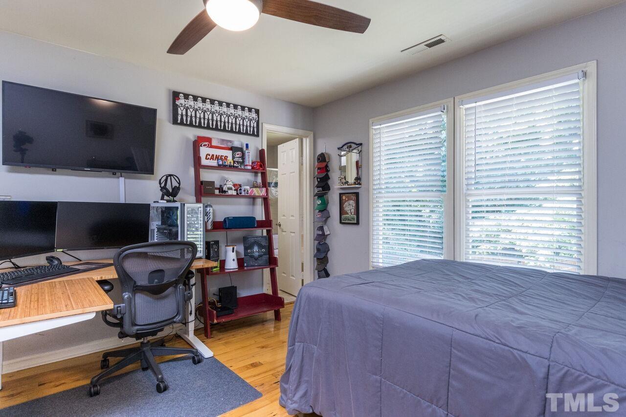 2400 Long And Winding Road Raleigh, NC 27603 - Photo 23 of 29 a bedroom with furniture and a flat screen tv