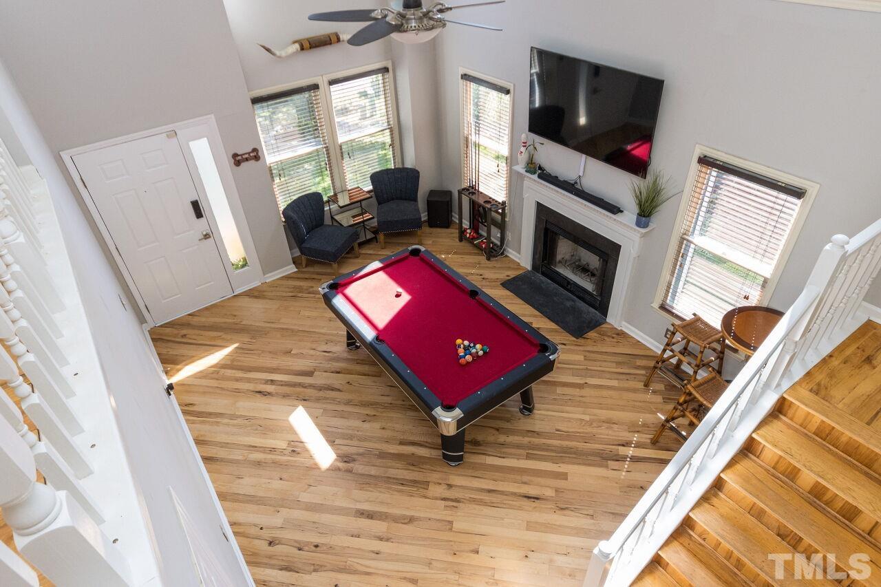 2400 Long And Winding Road Raleigh, NC 27603 - Photo 8 of 29 a living room with furniture and a flat screen tv