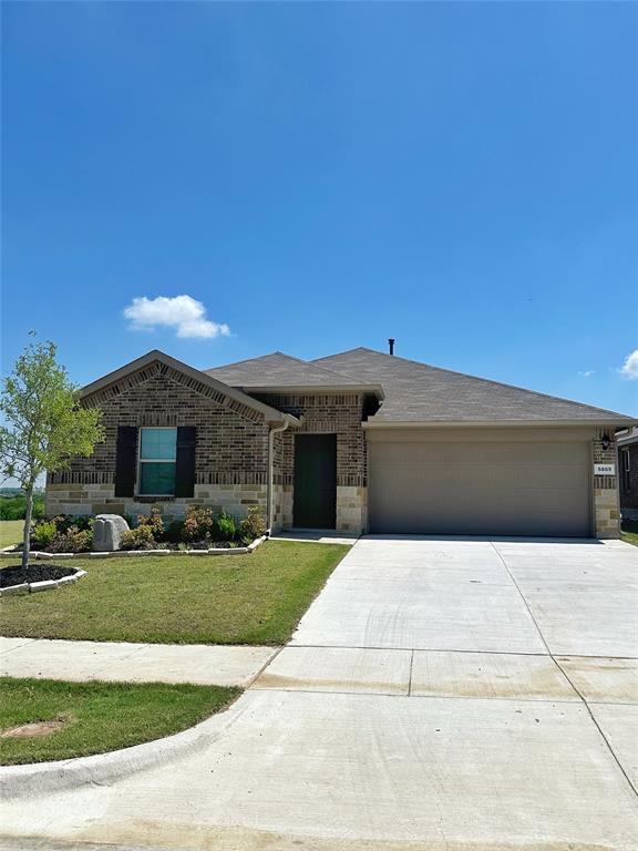 a backyard of a house with yard fire pit and outdoor seating