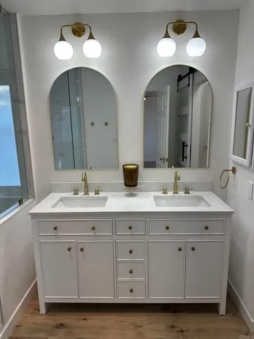 a view of a room with wooden floor and toilet