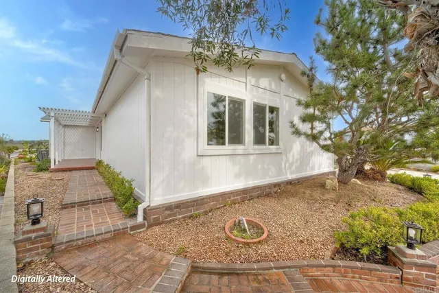 a view of a house with a small yard