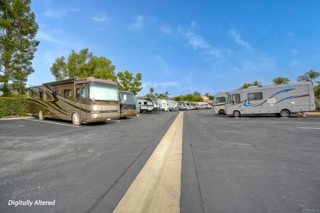 a view of a house with a yard and a tree
