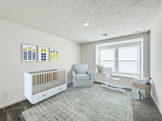 a bedroom with furniture and windows