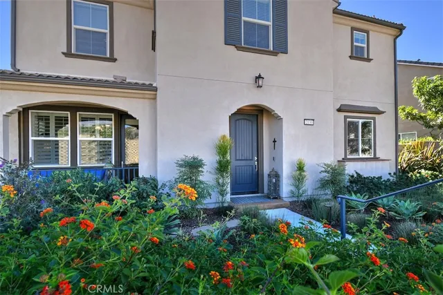 front view of the house with potted plants