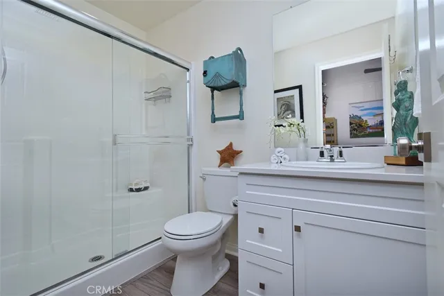 a bedroom with a bed dresser and a window