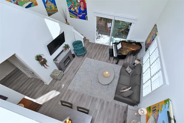 a bathroom with double vanity a toilet a a mirror a vanity and a shower