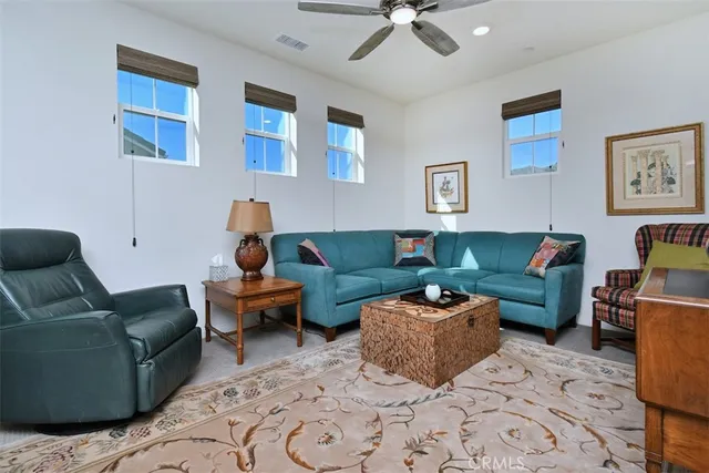 a view of walk in closet with clothes