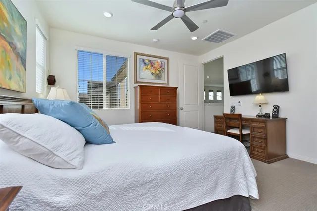 a view of a patio with table and chairs potted plants and large tree