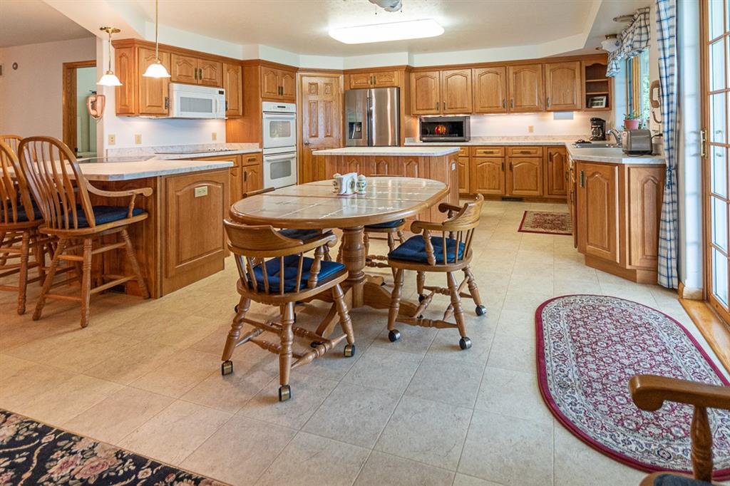910 Latonka Drive Mercer, PA 16137 - Photo 21 of 38 a dining room with furniture and a kitchen view