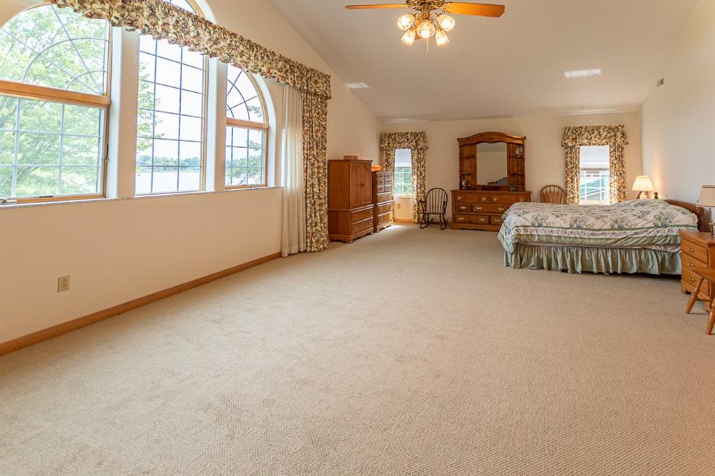910 Latonka Drive Mercer, PA 16137 - Photo 32 of 38 an empty room with windows and chandelier